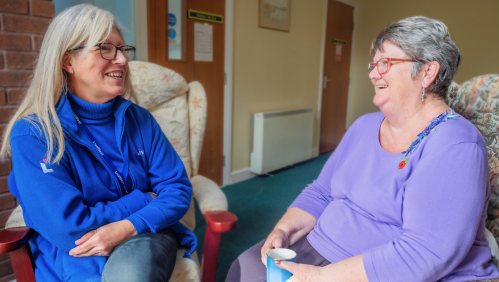 LiveWest colleague talking to one of our residents, Jenny, about her new windows.