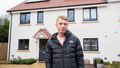 First-time buyer, Jack Benjamin outside his new energy-efficient home.