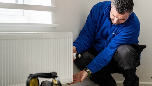 LiveWest colleague fixing a radiator.