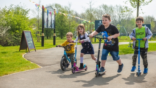 children on bikes and scooters