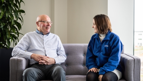 Our Vice Chair of InFocus (left) smiling next to one of our colleagues.