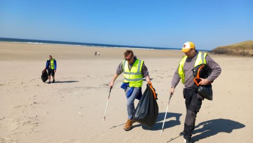 LiveWest colleagues litter picking on a beach.
