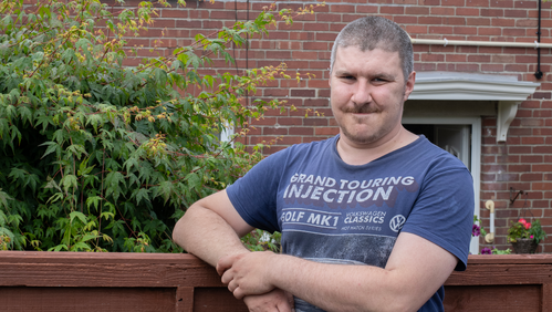 Image of Robert Osborne outside of his home