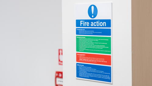 Fire action poster on a wall