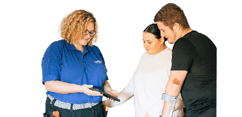 LiveWest colleague showing two customers a digital tablet.